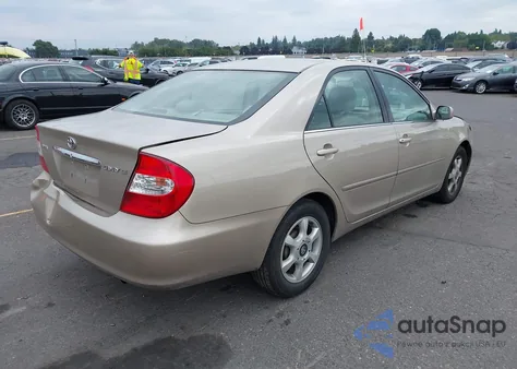 2003 Toyota Camry Le z USA, uszkodzony, nr VIN 4T1BE32K93U728791